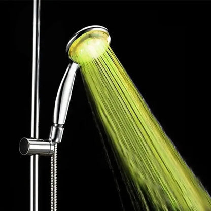 MoodGlow LED Shower Head glowing green with water flow on chrome shower fixture
