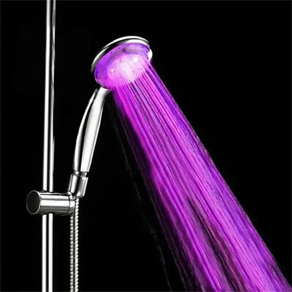 MoodGlow LED Shower Head with 7-color water-powered LED lights glowing purple during shower use